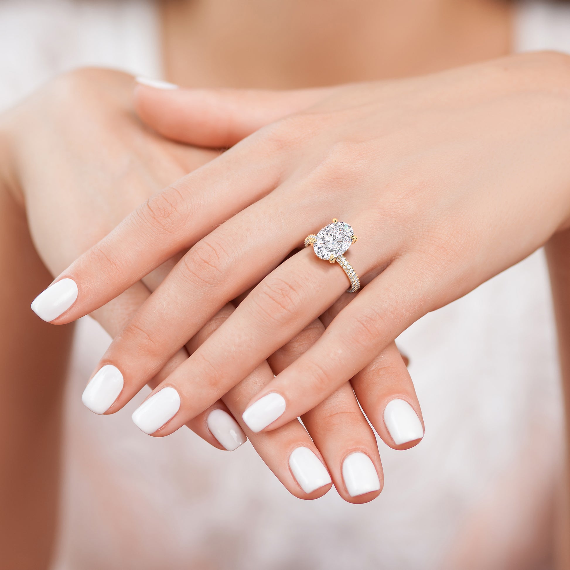 Pear shaped diamond engagement ring in yellow gold worn on hand, elegant three stone ring with tapered baguette diamonds and refined sparkle | #14KRecycledYellowGold #18KRecycledYellowGold