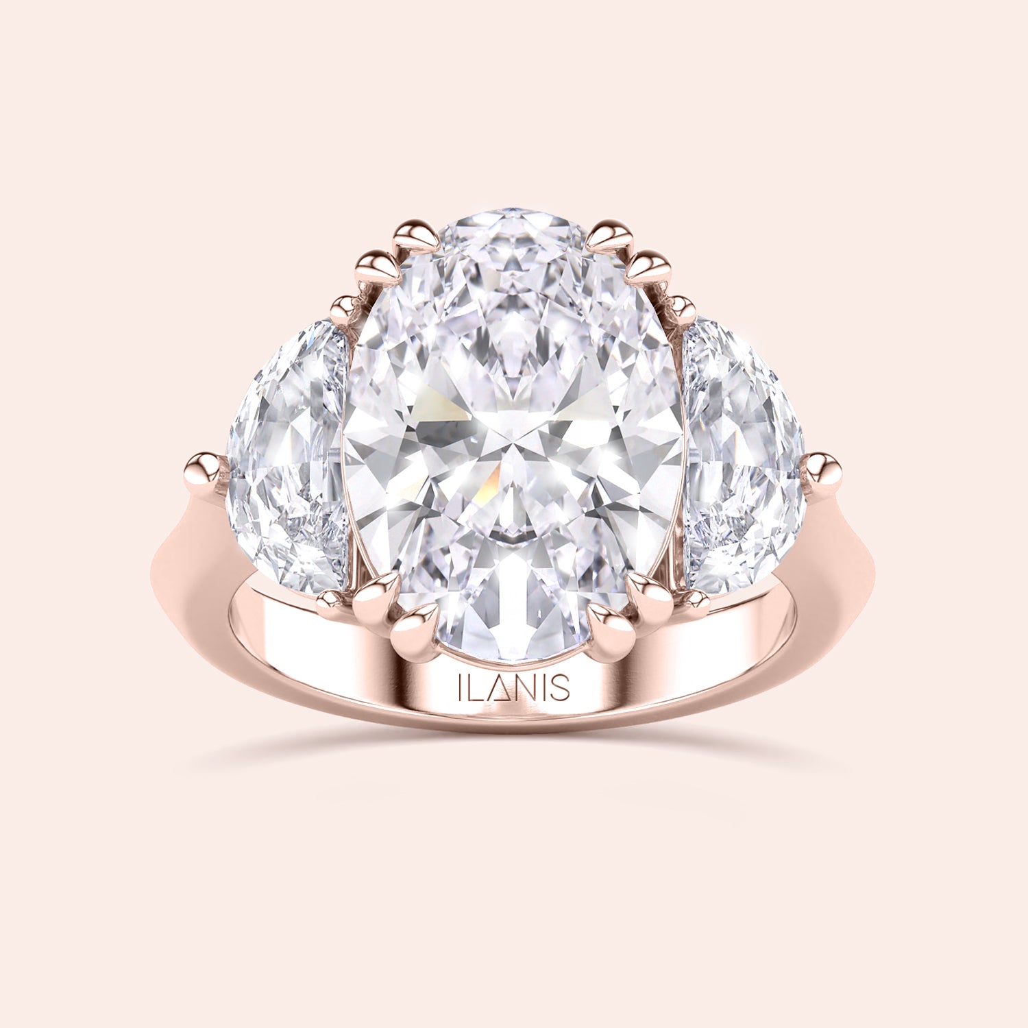 Oval shaped diamond ring in rose gold, top view highlighting brilliance of center diamond and symmetry of pear side stones |#14KRecycledRoseGold #18KRecycledRoseGold