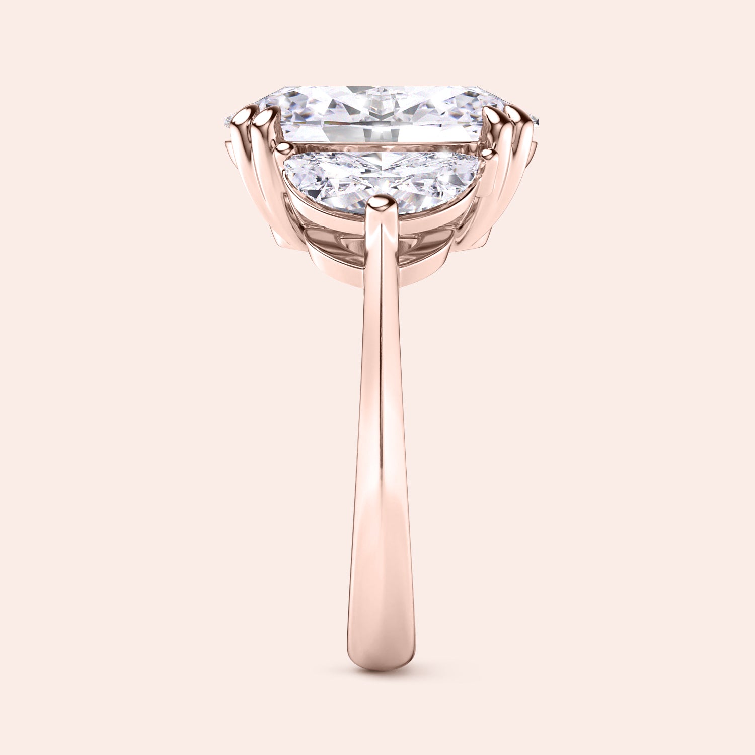 Oval diamond engagement ring in rose gold with three stone setting, side angle showing prong setting and clean elegant structure | #14KRecycledRoseGold #18KRecycledRoseGold