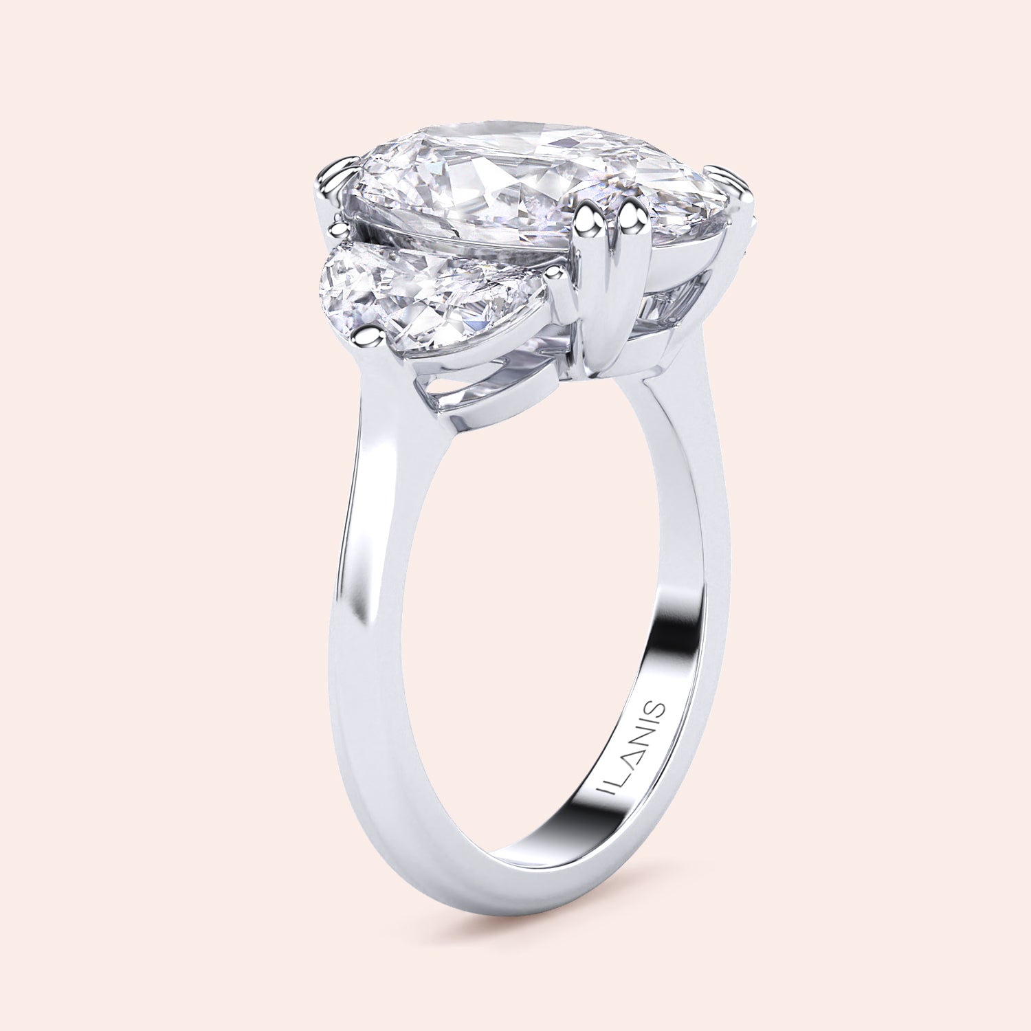 Oval diamond three stone engagement ring in white gold with pear shaped side stones, side profile showcasing elevated basket setting and refined craftsmanship | #14KRecycledWhiteGold #18KRecycledWhiteGold #Platinum