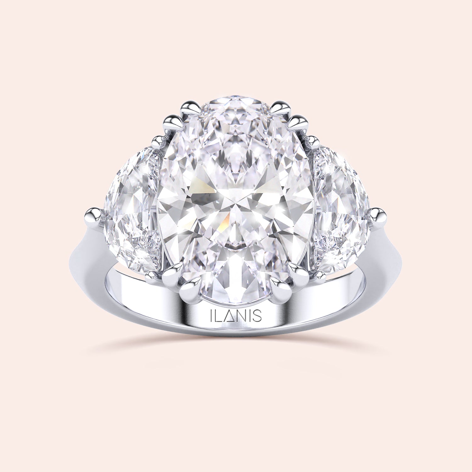 Oval shaped diamond ring in white gold, top view highlighting brilliance of center diamond and symmetry of pear side stones |#14KRecycledWhiteGold #18KRecycledWhiteGold #Platinum