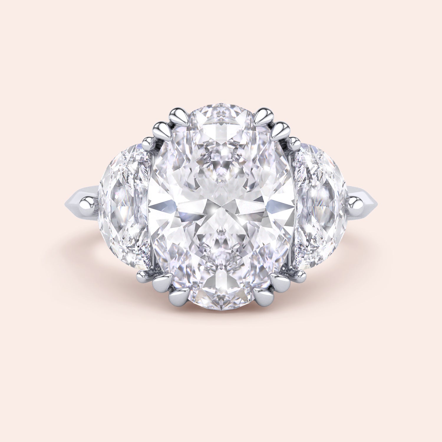 Oval cut diamond engagement ring in white gold with pear side diamonds, classic three stone design with brilliant center stone | #14KRecycledWhiteGold #18KRecycledWhiteGold #Platinum