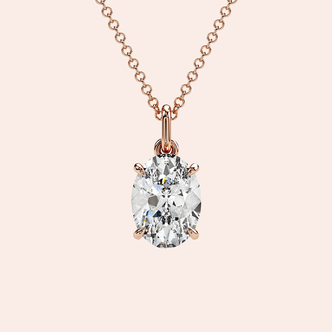 A close-up of a stunning oval-cut diamond pendant in a four-prong rose gold setting. The minimalist yet elegant design highlights the brilliance of the diamond, making it perfect for any occasion.
| #14KRecycledRoseGold #18KRecycledRoseGold