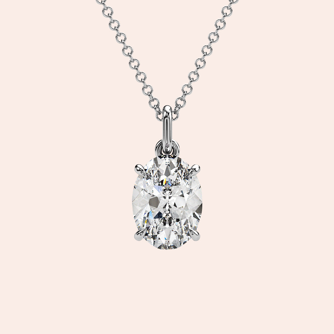 A stunning close-up of an oval-cut diamond pendant in a four-prong white gold setting. The timeless simplicity of this solitaire pendant makes it an ideal gift or personal keepsake.
| #14KRecycledWhiteGold #18KRecycledWhiteGold