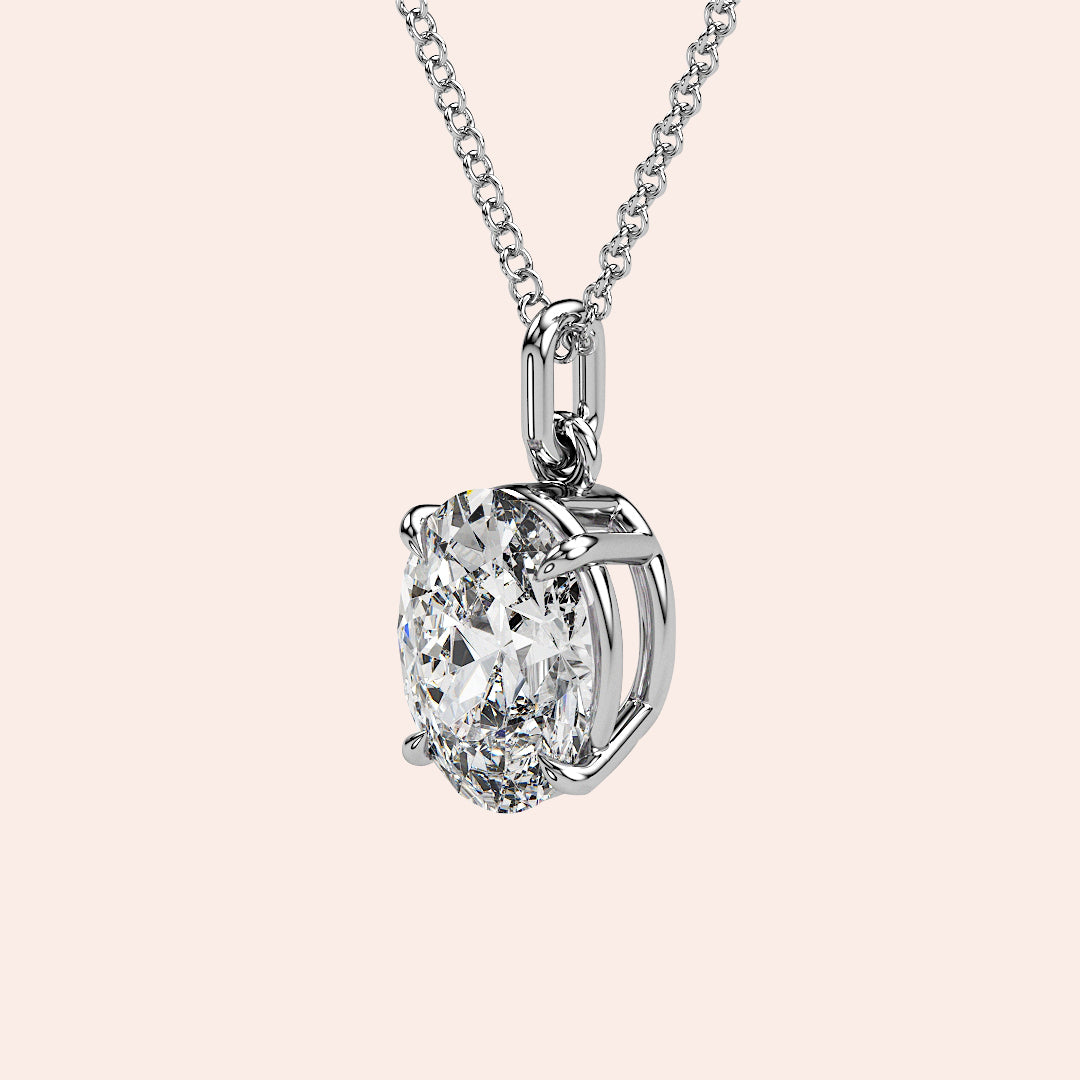 A detailed side view of an oval-cut solitaire diamond pendant in white gold, featuring a secure prong setting that maximizes light reflection for extraordinary brilliance.
| #14KRecycledWhiteGold #18KRecycledWhiteGold

