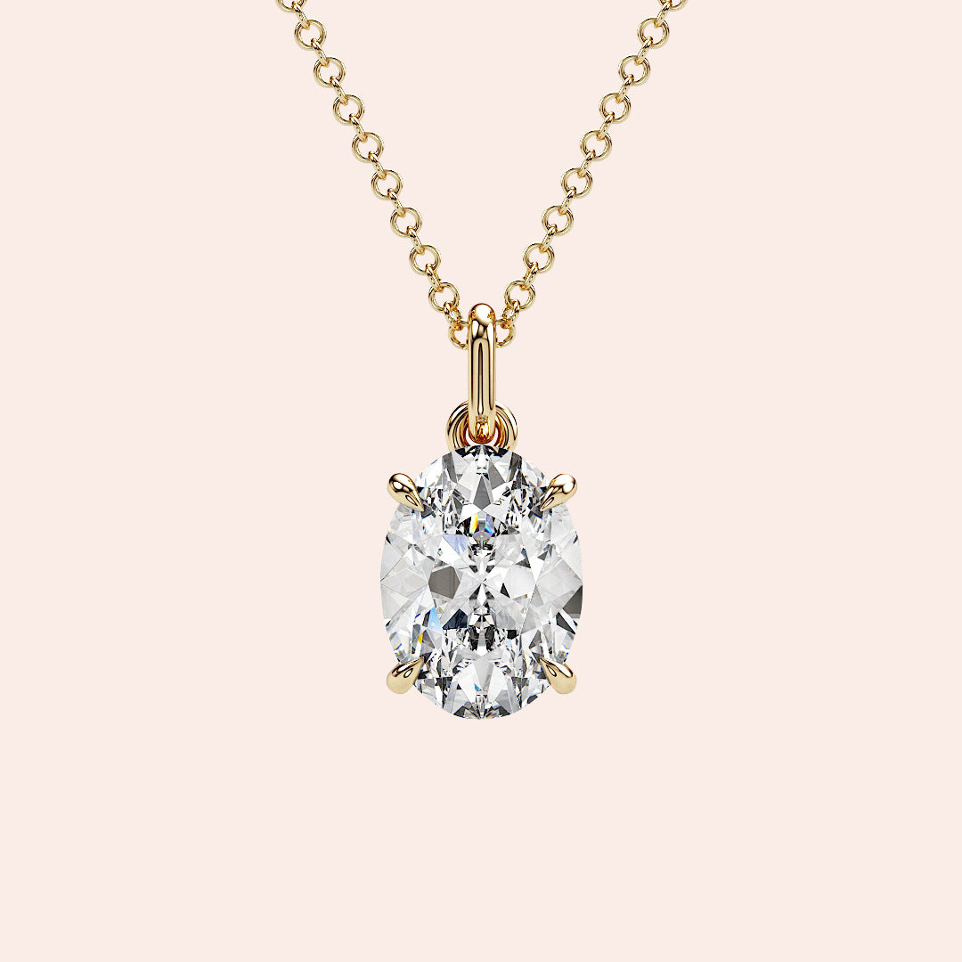 A stunning close-up of an oval-cut diamond pendant in a four-prong yellow gold setting. The timeless simplicity of this solitaire pendant makes it a meaningful gift or a treasured keepsake.
