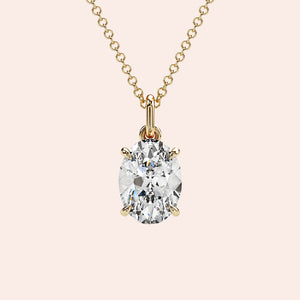 A stunning close-up of an oval-cut diamond pendant in a four-prong yellow gold setting. The timeless simplicity of this solitaire pendant makes it a meaningful gift or a treasured keepsake.
