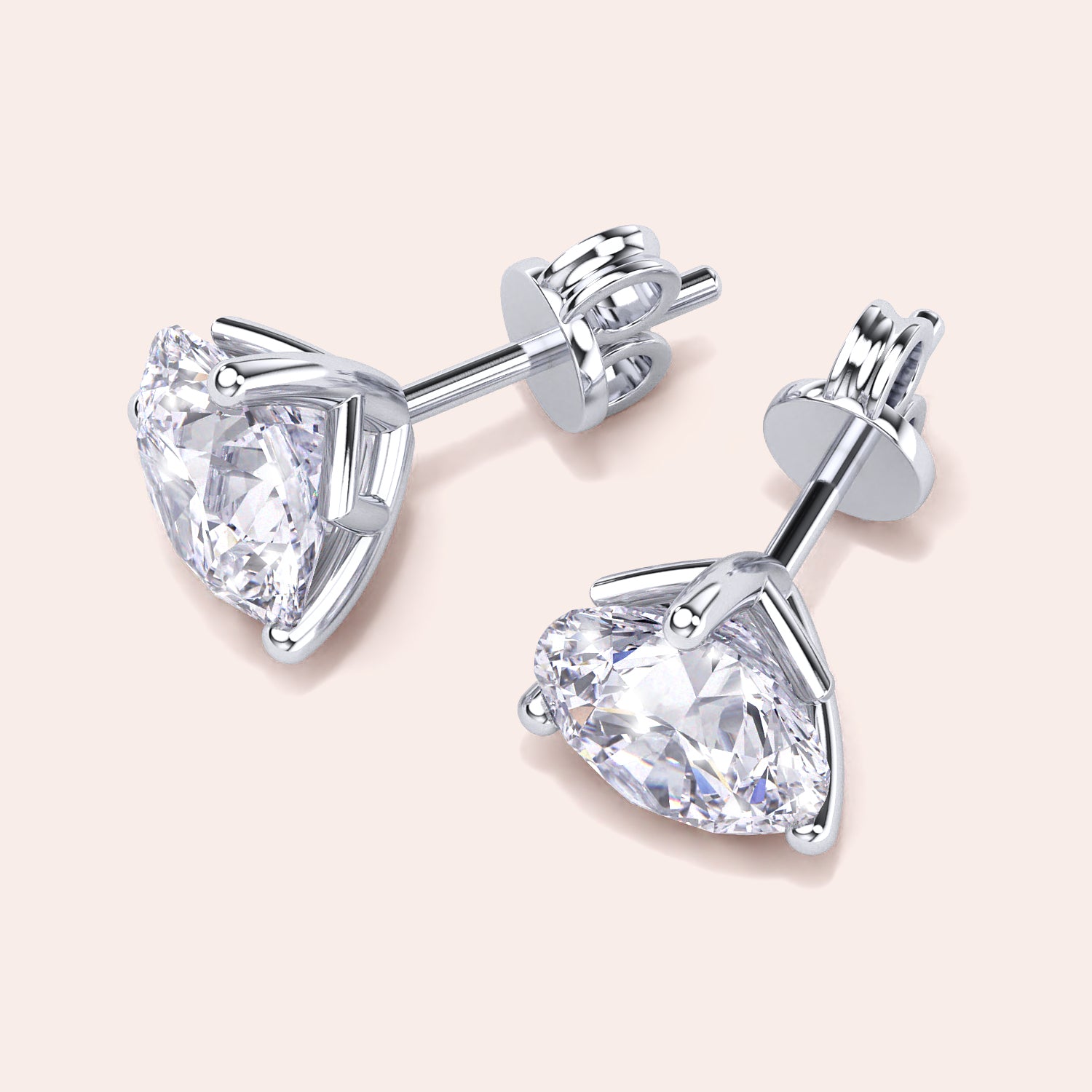 Timeless 3-Prong Martini Diamond Stud Earrings in white gold on a soft pink background |

#14KRecycledWhiteGold
#18KRecycledWhiteGold
#Platinum

