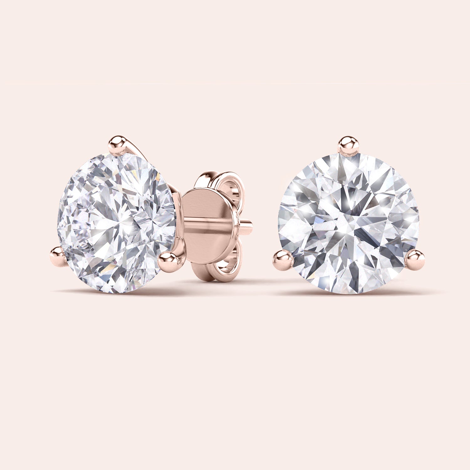 Timeless 3-Prong Martini Diamond Stud Earrings in 14kt/18kt rose gold on a soft pink background |

#14KRecycledRoseGold
#18KRecycledRoseGold

