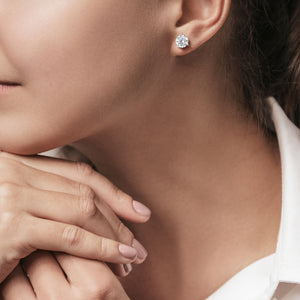 Elegant woman showcasing 3-Prong Martini Diamond Stud Earrings in 14kt white gold 