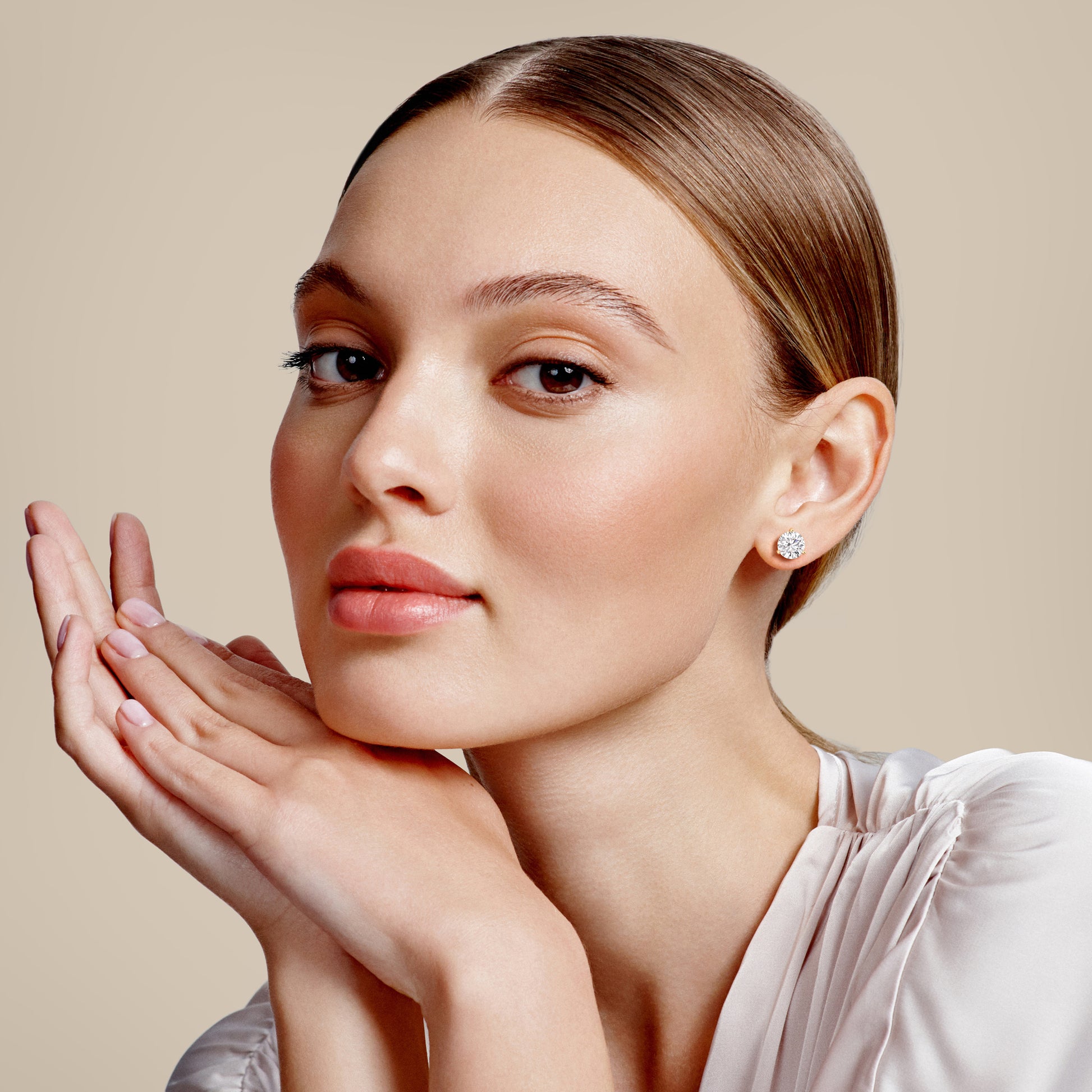 Profile view of young woman wearing 3-Prong Martini Stud Earrings in 14kt/18kt rose gold |

#14KRecycledRoseGold 
#18KRecycledRoseGold 

