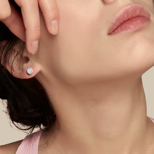 Profile view of young woman wearing 3-Prong Martini Stud Earrings in 14kt/18kt rose gold 