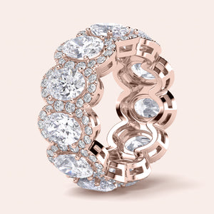 Elegant rose gold eternity band featuring marquise-cut diamonds, available in 14K and 18K gold or platinum.  Wedding band design. 