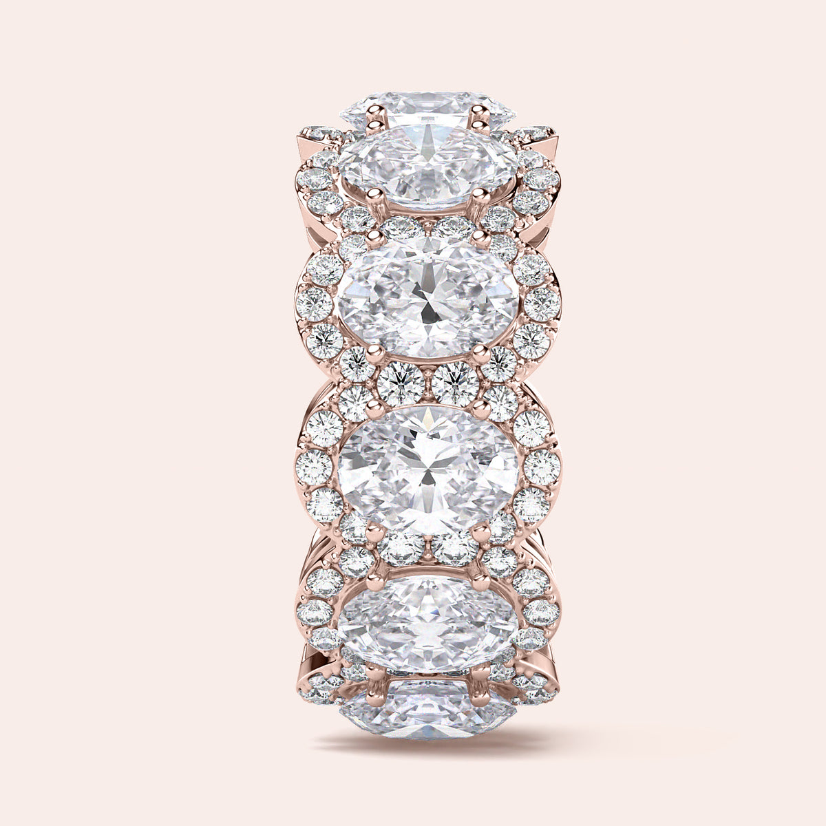 Elegant rose gold eternity band featuring marquise-cut diamonds, available in 14K and 18K gold or platinum.  Wedding band design. 