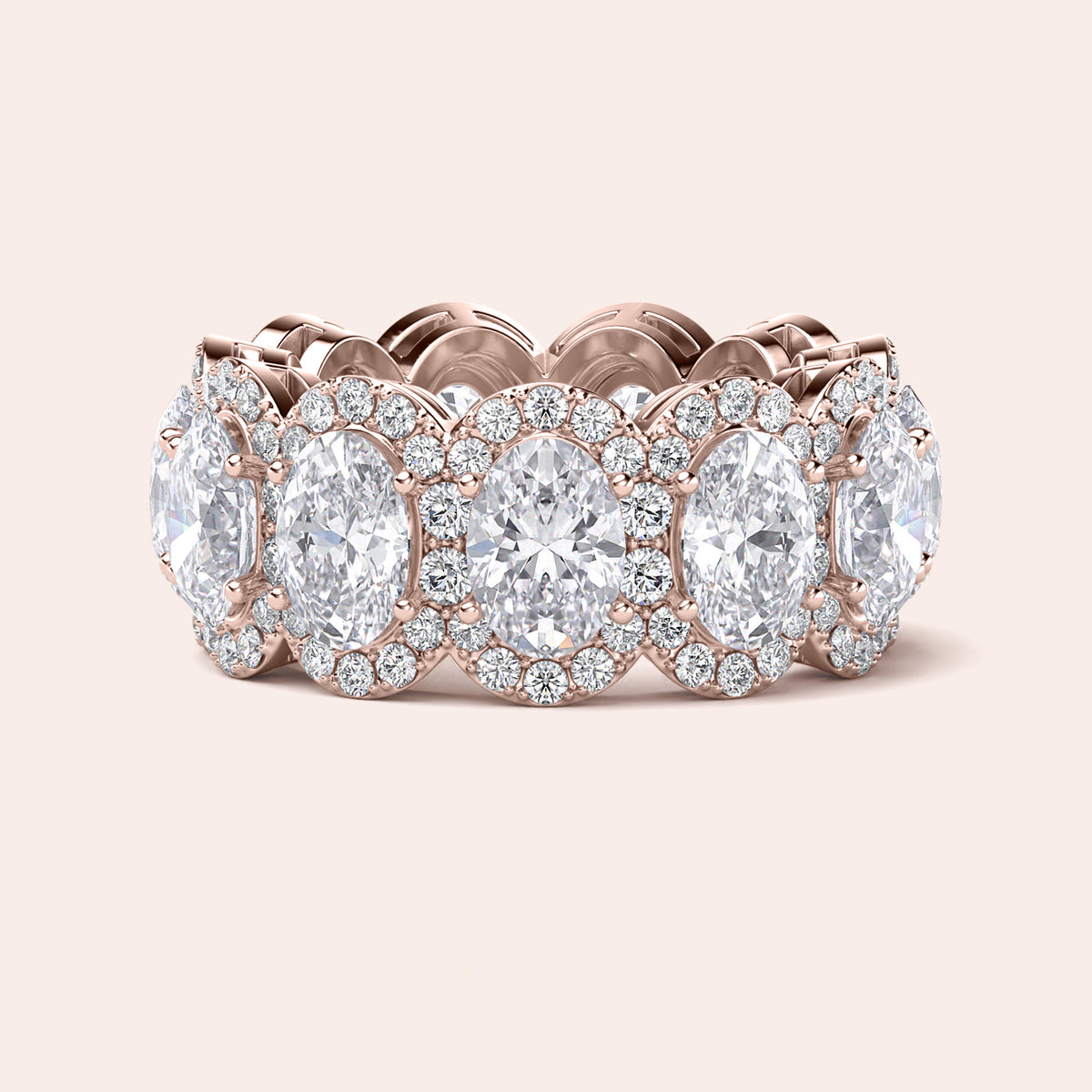 Elegant rose gold eternity band featuring marquise-cut diamonds, available in 14K and 18K gold or platinum.  Wedding band design. 