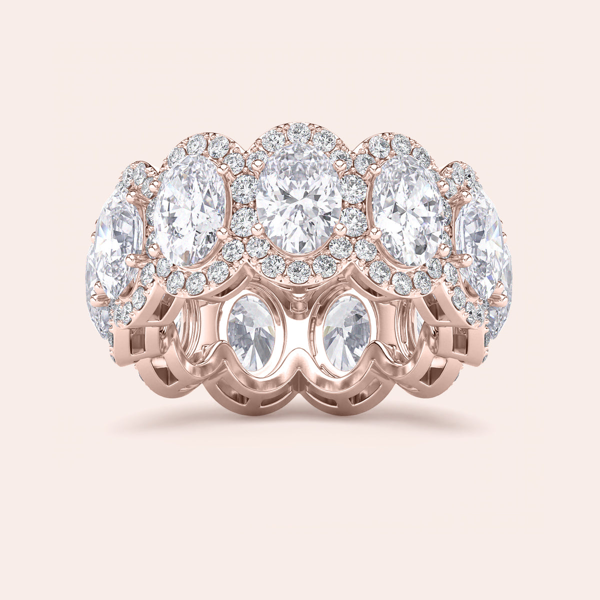 Elegant rose gold eternity band featuring marquise-cut diamonds, available in 14K and 18K gold or platinum.  Wedding band design. 