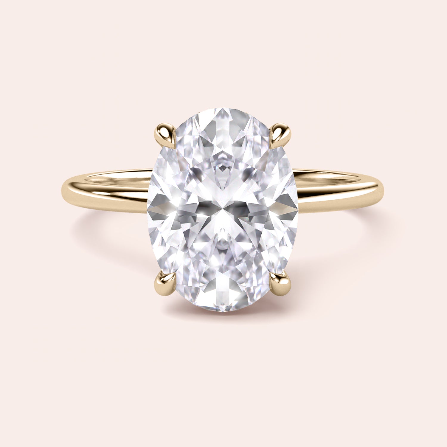 Elegant oval diamond engagement ring in polished 14K gold, luxurious 18K gold, or premium platinum, showcasing a stunning solitaire design.