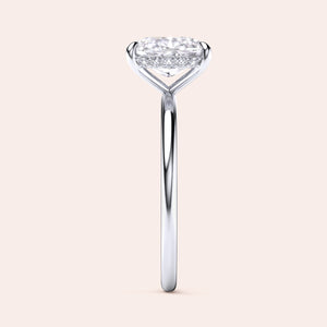 Elegant oval diamond solitaire engagement ring in luxurious 14K, 18K gold, or platinum, showcasing exquisite craftsmanship. 