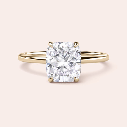Elegant cushion-cut diamond ring in polished band, available in 14K, 18K, or platinum for timeless luxury and sparkle. 