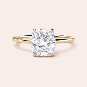Elegant cushion-cut diamond ring in polished band, available in 14K, 18K, or platinum for timeless luxury and sparkle. 