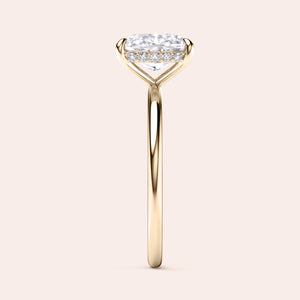 Elegant 14K/18K gold ring with heart-shaped diamond solitaire and accent diamonds, displayed unworn on a neutral background. 