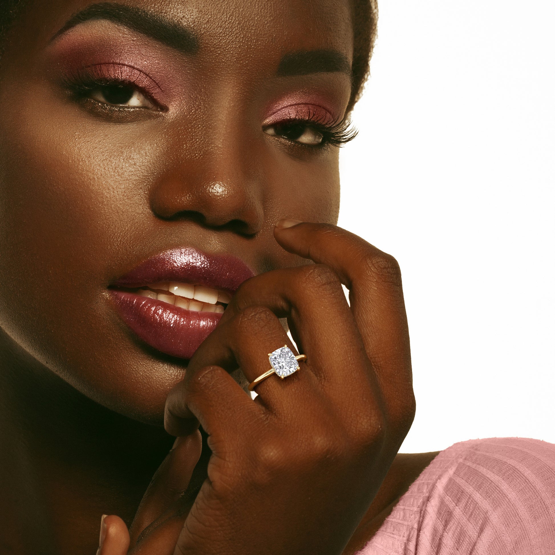 Close-up of a model wearing a radiant-cut diamond ring in 14K gold, 18K gold, or platinum, epitomizing elegance and fine craftsmanship. |


#14KRecycledYellowGold 
#18KRecycledYellowGold 