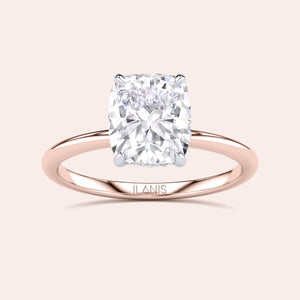 Two-tone 14K/18K rose and white gold engagement ring featuring a cushion-cut diamond in a secret halo setting. 