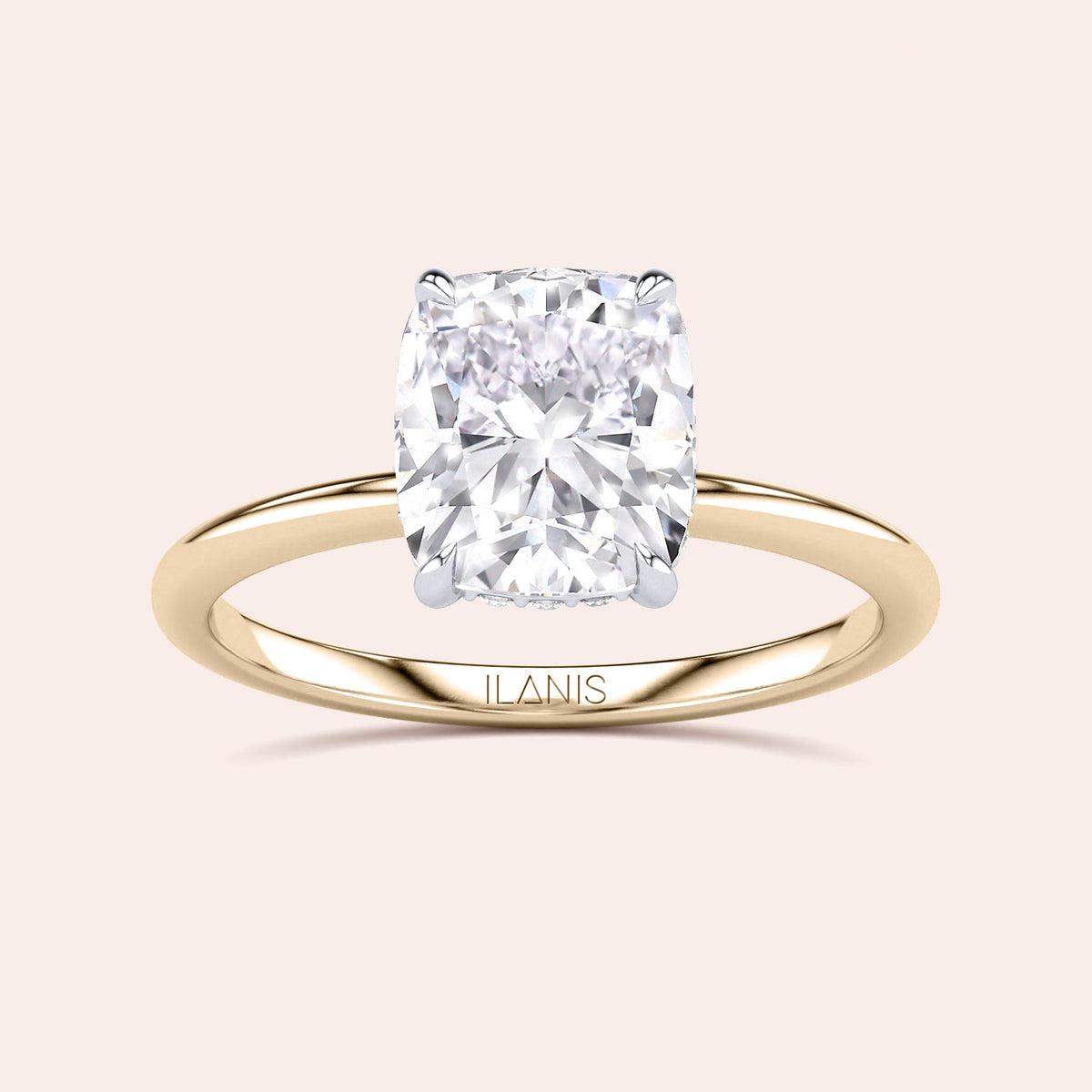 Two-tone 14K/18K white and yellow gold cushion-cut diamond ring, featuring a secret halo design, perfect for engagement or weddings. 