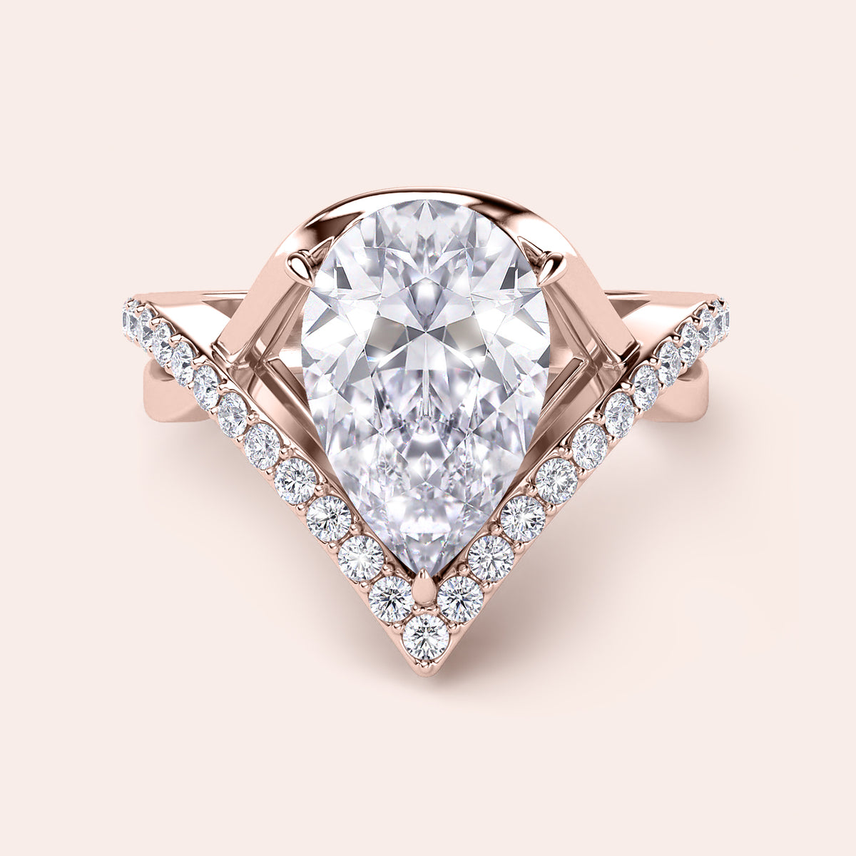 Elegant pear-shaped diamond ring in 14K/18K gold or platinum with V-shaped design and sparkling round diamonds.