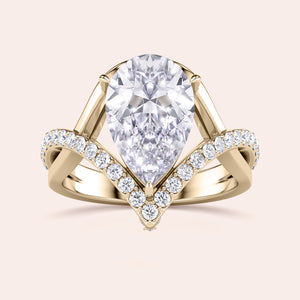 Elegant teardrop diamond ring in 14K or 18K gold or platinum, featuring a pave setting with a stunning diamond display.