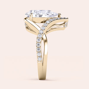 Elegant engagement ring with marquise-cut diamond, set in 14K, 18K gold, or platinum, featuring sparkling round diamonds.