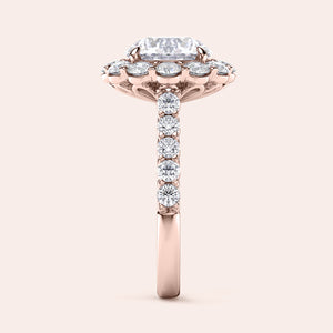 Elegant rose gold ring featuring an emerald-cut diamond surrounded by a halo of round diamonds, in 14K or 18K gold or platinum.
