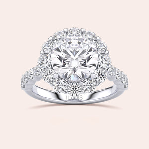 Luxurious round-cut diamond halo engagement ring in 14K, 18K gold, or platinum with a stunning cluster of smaller diamonds.