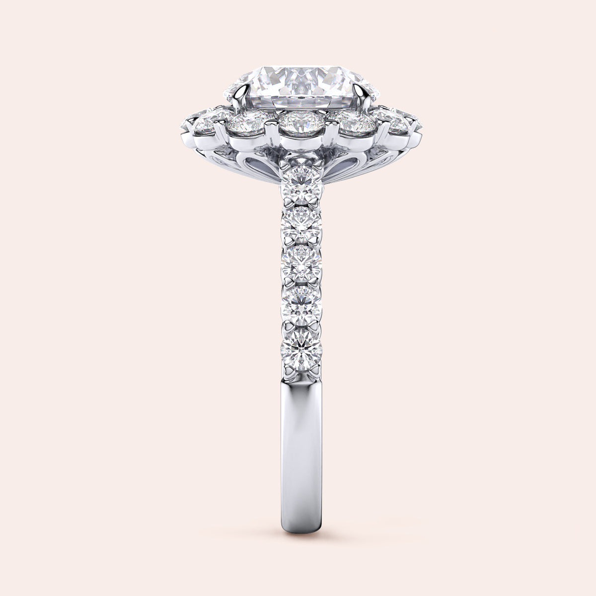 Elegant engagement ring with a radiant-cut diamond in a 14K or 18K gold or platinum band, showcasing a dazzling halo and pavé design.