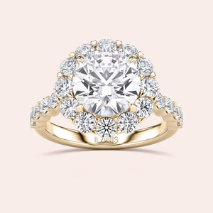 Elegant 14K or 18K gold halo engagement ring with a dazzling diamond centerpiece and sparkling diamonds, perfect for timeless beauty.