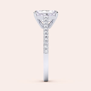 Elegant 14K or 18K gold and platinum ring featuring an emerald-cut diamond, showcasing intricate craftsmanship, perfect for engagements.