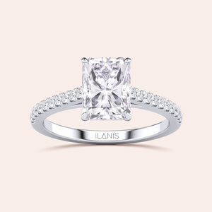 Elegant engagement ring with a radiant-cut diamond in 14K/18K gold or platinum, featuring smaller diamonds for exquisite elegance.