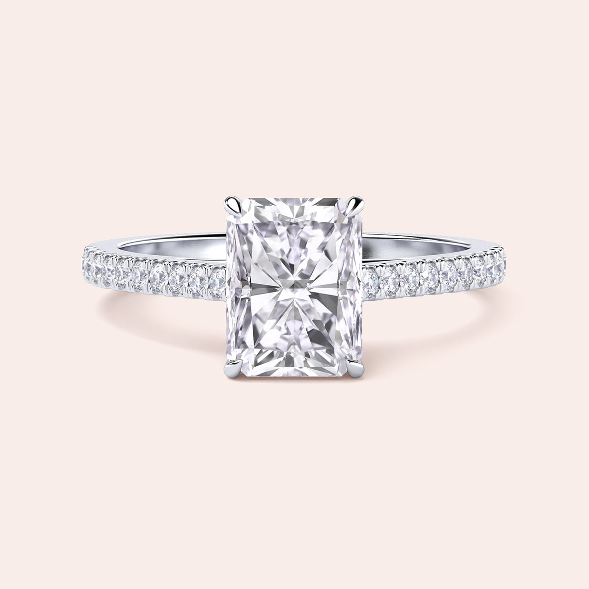 Radiant cut diamond ring with pavé band in customizable 14K, 18K gold, or platinum, perfect for elegant occasions.