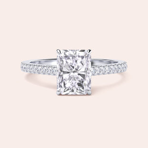 Radiant cut diamond ring with pavé band in customizable 14K, 18K gold, or platinum, perfect for elegant occasions.