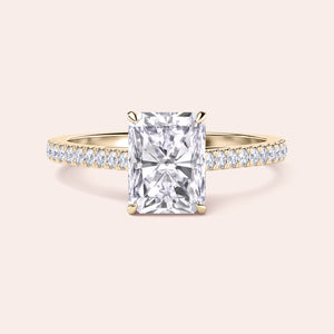 Elegant radiant-cut diamond engagement ring in classic yellow gold, available in 14K and 18K, featuring a stunning diamond-studded band.
