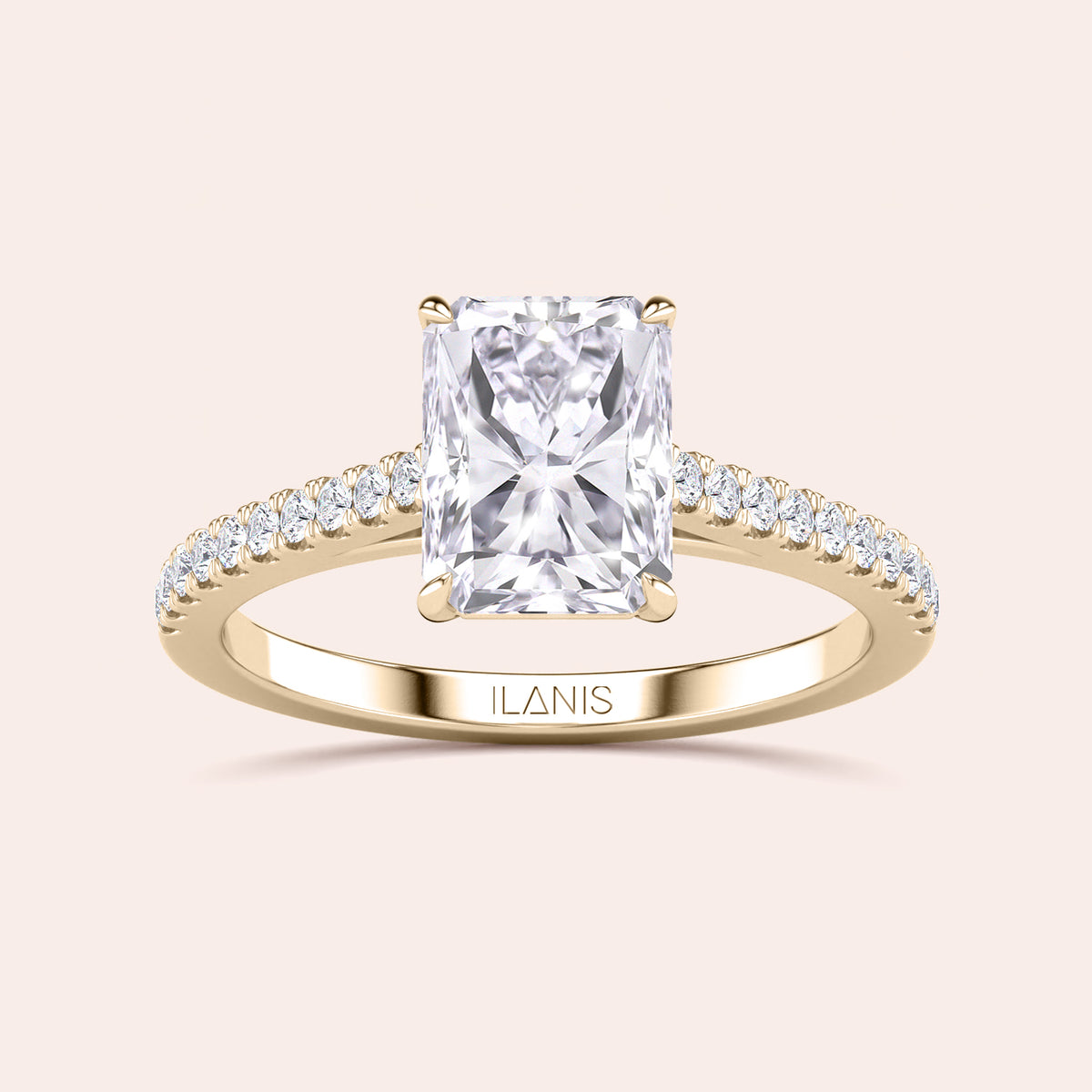 Radiant-cut diamond engagement ring in 14K gold with sparkling band, showcasing luxury and elegance on a neutral background.