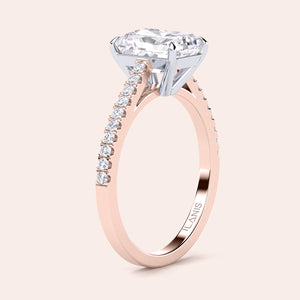 Two-tone 14K rose and white gold diamond engagement ring with radiant-cut stone and pave diamond band, elegant cathedral setting. 