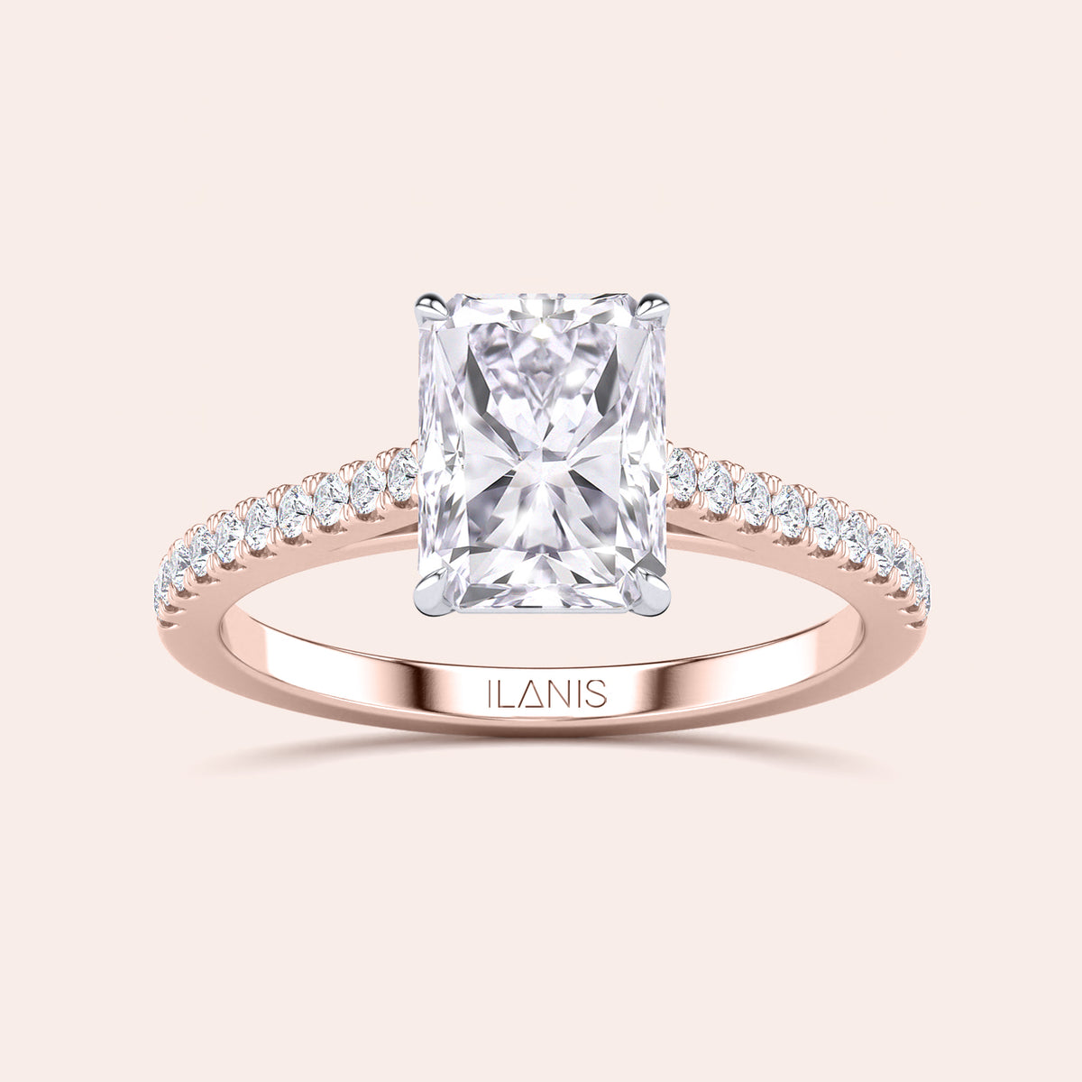 Two-tone 14K or 18K rose and white gold engagement ring featuring a grey radiant-cut diamond in a cathedral setting. 