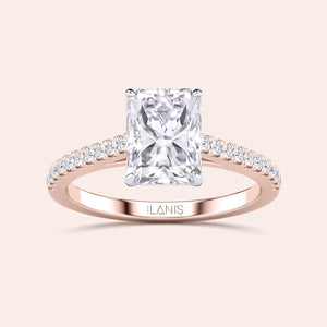 Two-tone 14K or 18K rose and white gold engagement ring featuring a grey radiant-cut diamond in a cathedral setting. 