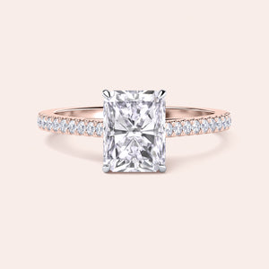 "Two-tone 14K/18K gold engagement ring featuring a radiant-cut diamond in a cathedral setting with a pave band." 
