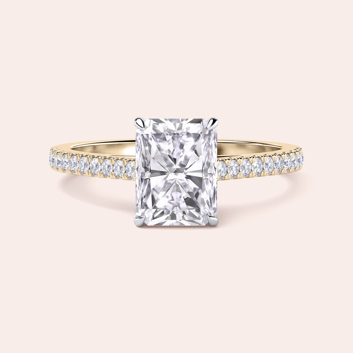 Two-tone 14K/18K gold engagement ring featuring a radiant-cut diamond in a cathedral setting with pave diamond band. 