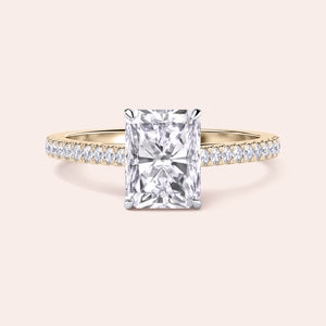 Two-tone 14K/18K gold engagement ring featuring a radiant-cut diamond in a cathedral setting with pave diamond band. 