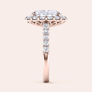 Elegant 14K engagement ring with a radiant cut diamond center, haloed by smaller diamonds on a refined band—perfect for proposals.