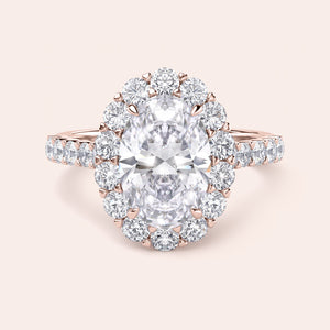 14K and 18K gold oval-shaped diamond halo engagement ring with round diamonds framing the center gem, exuding elegance.