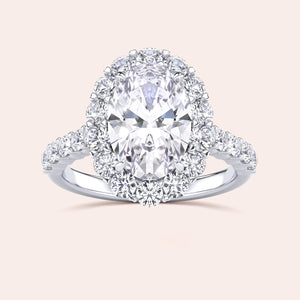 Elegant jewelry variant featuring an oval diamond and halo, crafted in 14K or 18K gold, or platinum for timeless sophistication.